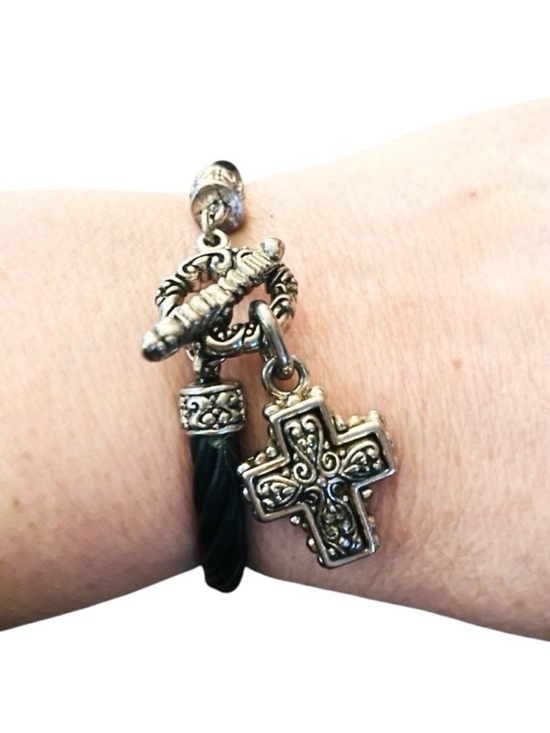Jewelry - Silver-toned cross pendant paired with a cord bracelet featuring a toggle clasp